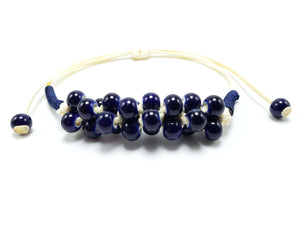 Handmade adjustable bracelet with dark blue beads and white cord